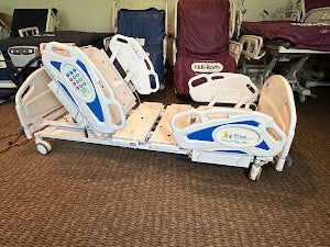 Prius Ai1 bariatric hospital bed with extra-wide high-low adjustable frame and side rails for patient comfort and safety.