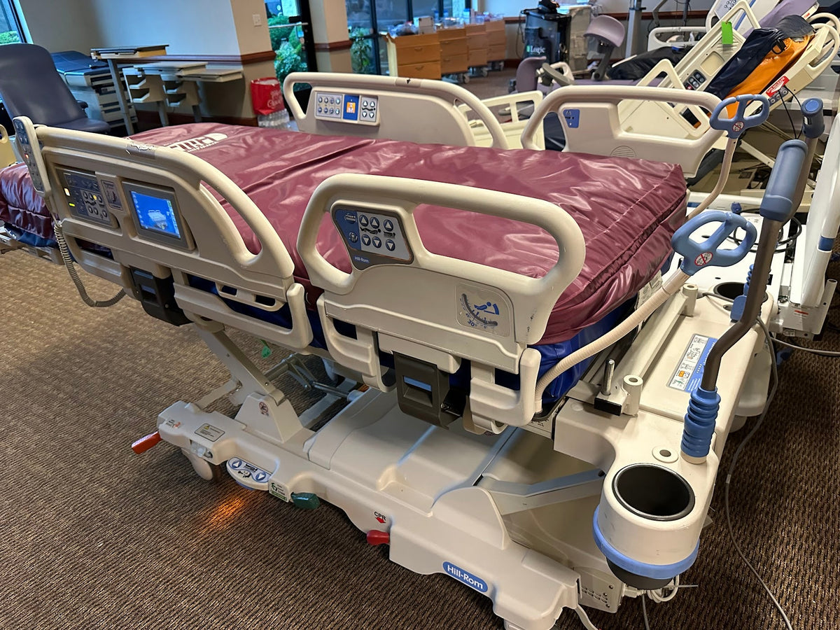 Hill Rom P7500 Progressa hospital bed with air mattress, featuring a sleek design and adjustable side rails.
