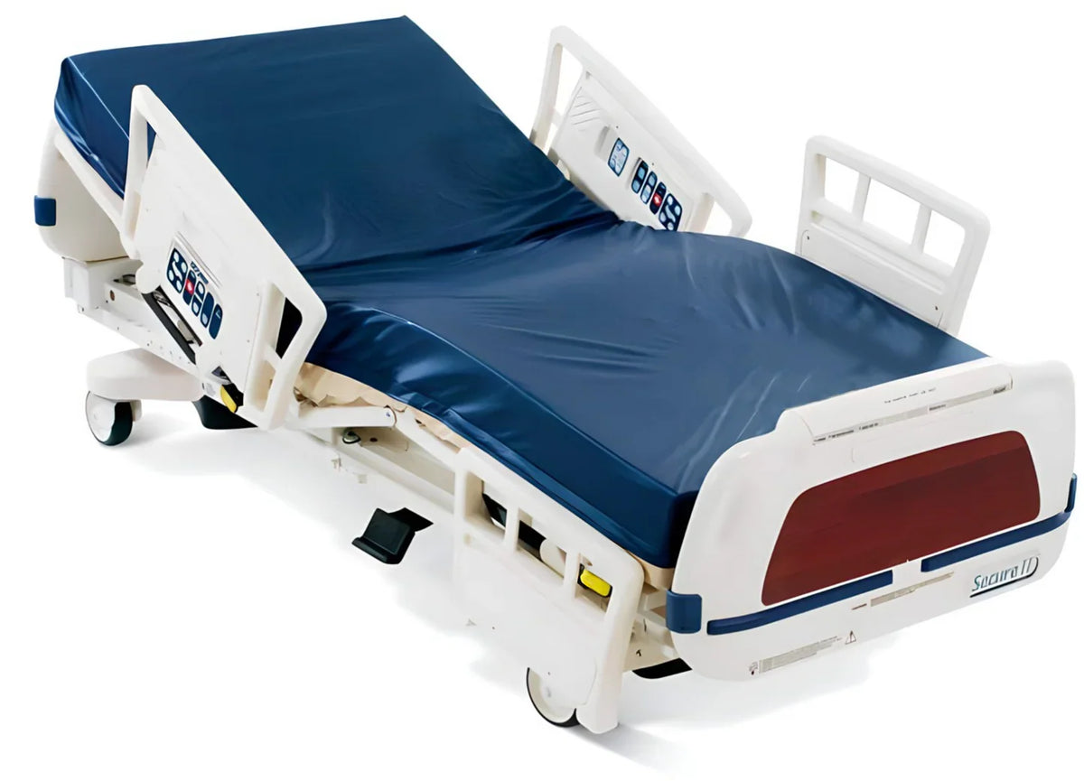 Stryker Secure 2 Model 3002 hospital bed with foam mattress, featuring adjustable side rails and medical-grade design.